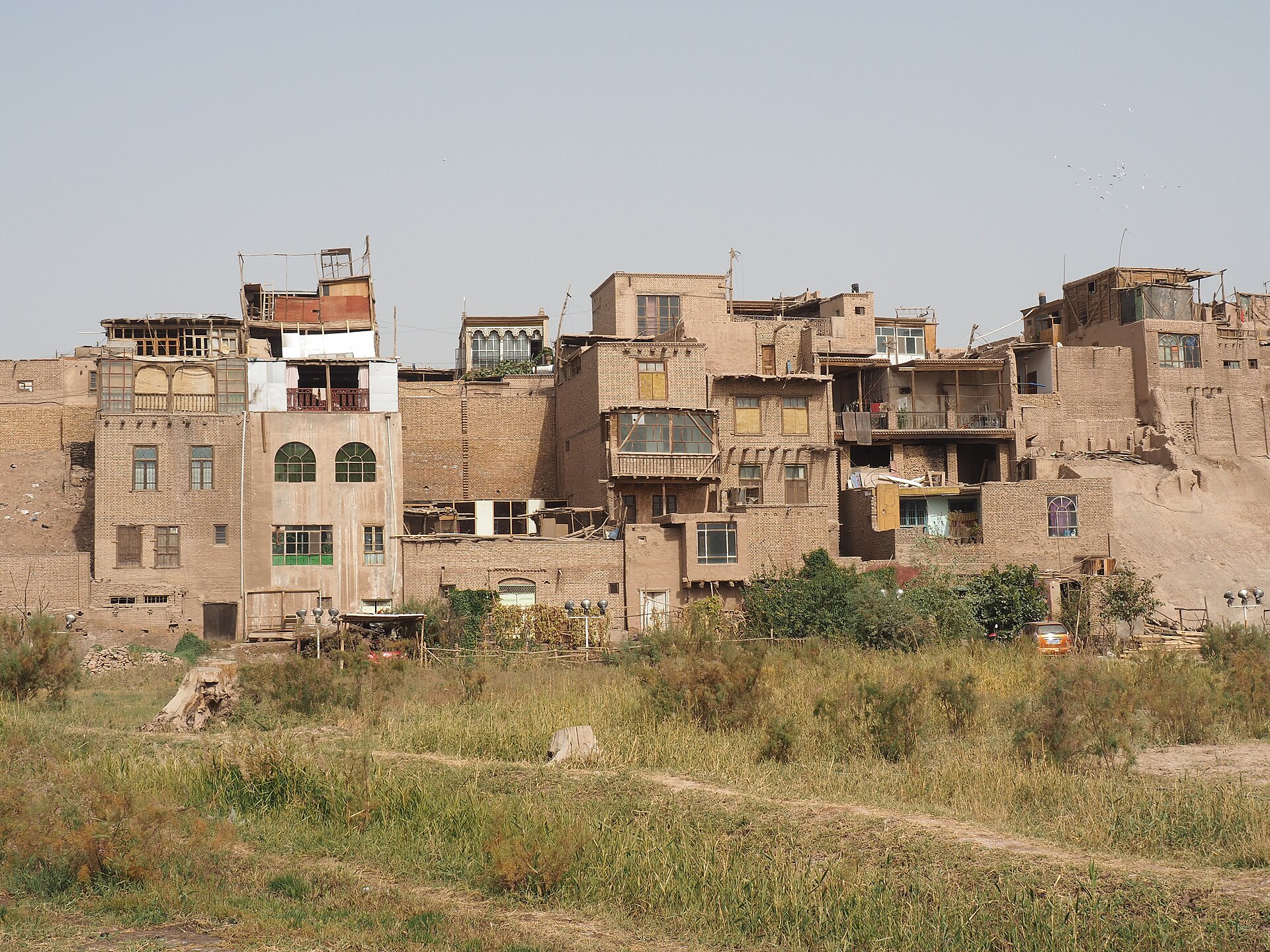 Layered brick and earth-toned buildings form an edge of Kashgar Old City in Xinjiang.