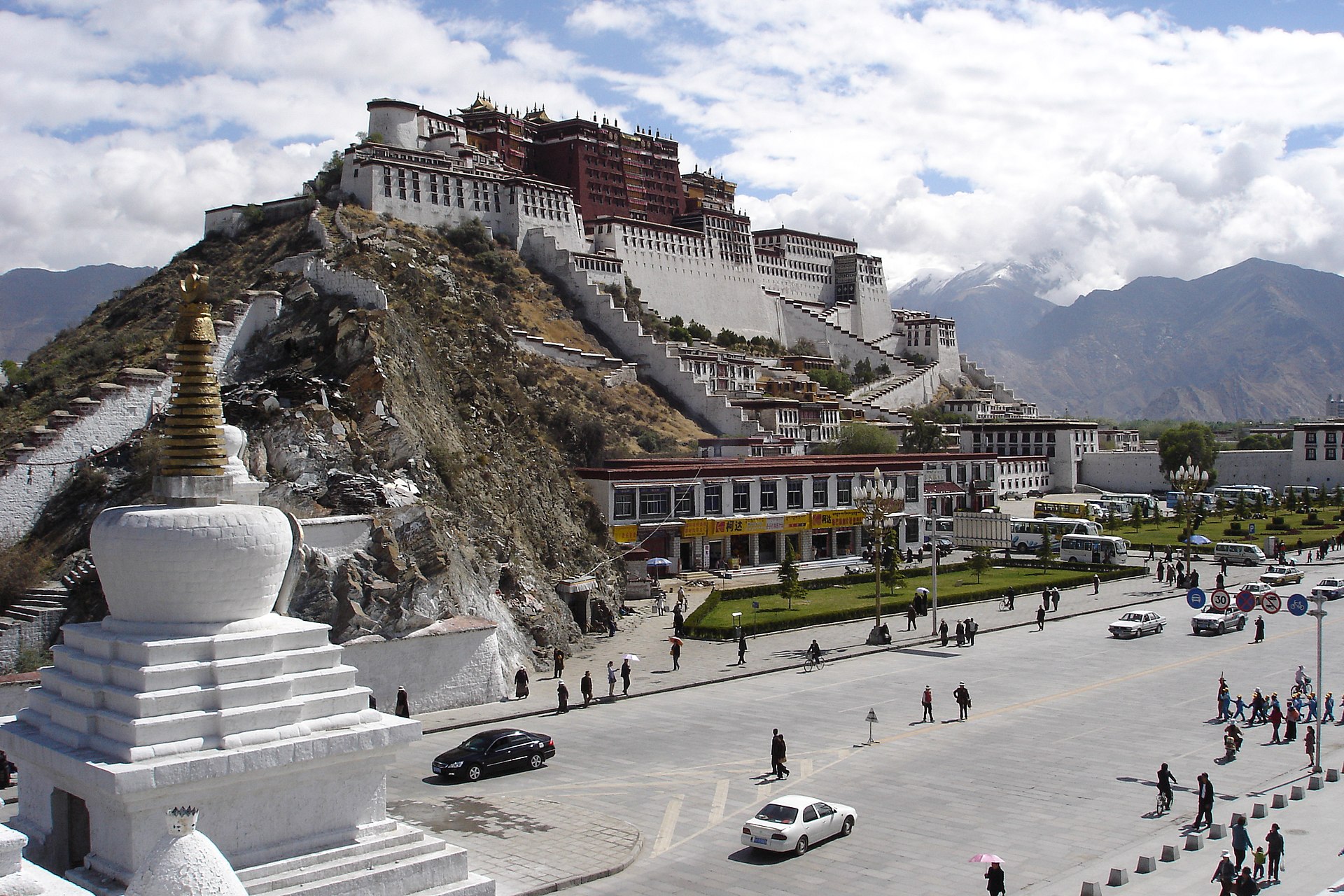 The Potala Palace above Lhasa with a white stupa in the foreground, photographed from Chagpo Ri in 2006.